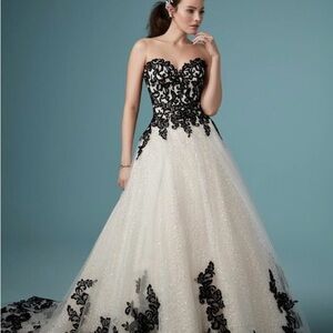 Maggie Sottero Wedding Gown. White with black lace accents.